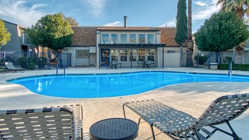 Somerpointe's Pool with Lounge Chairs next to it.